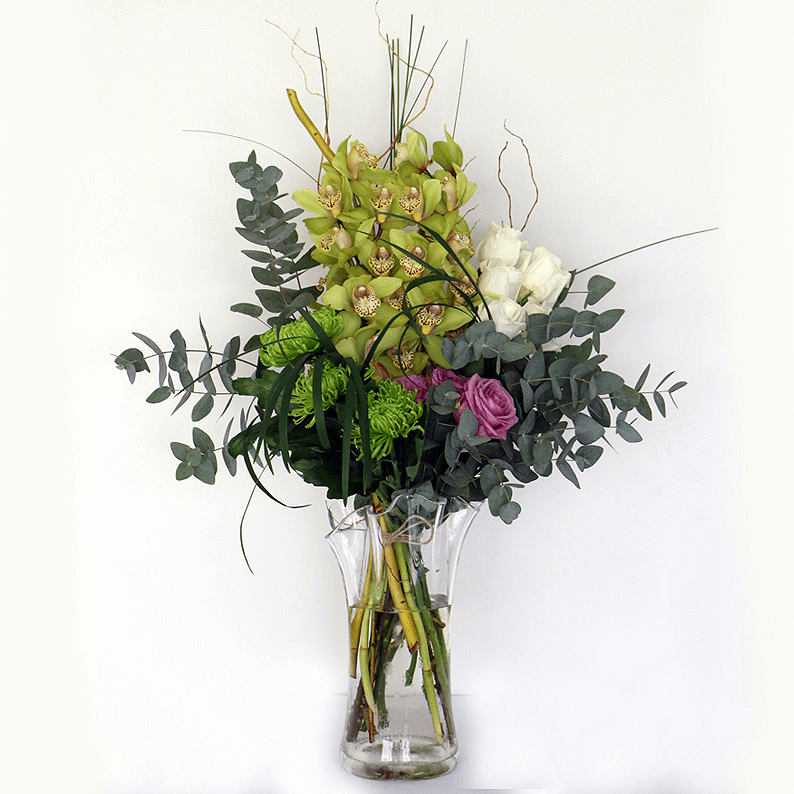 Weekly Flower Subscription 6 to 8 vases_1 orchids, roses, eucalyptus and grass arranged in a glass vase