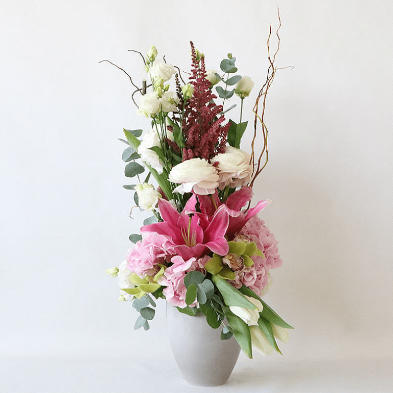 Weekly Flower Subscription 6 to 8 vases_2 pink lilies, astilbe, hydrangea, tulips arranged in a grey pot