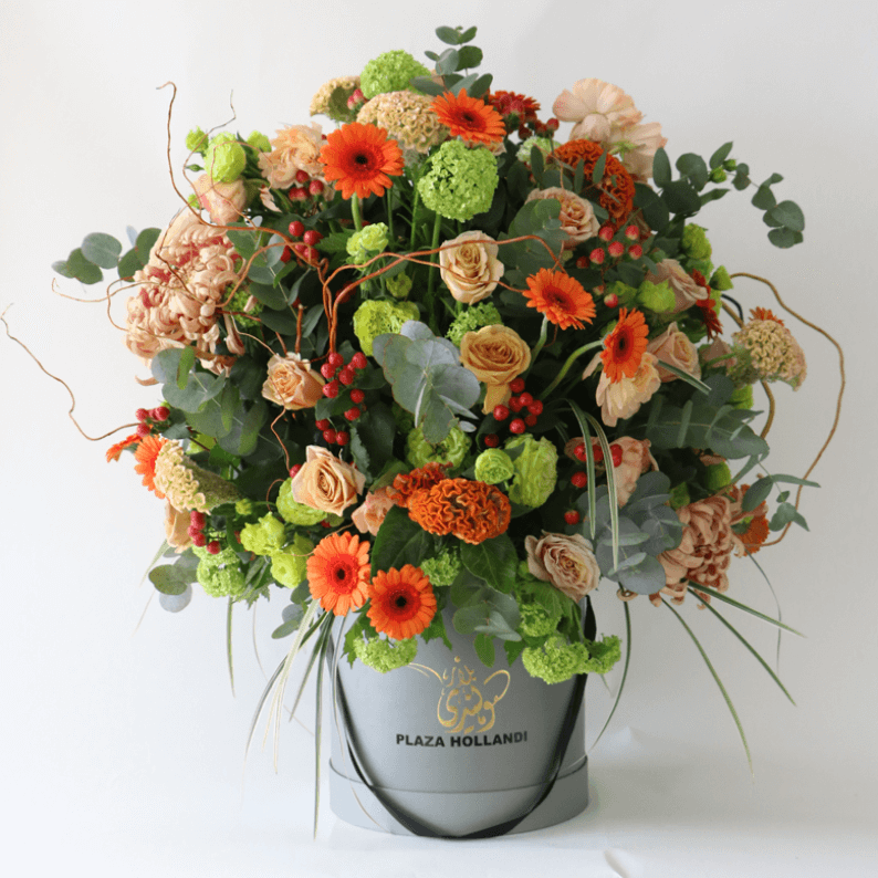 orange round european design in a hat box Orange germini, snowball, roses, hydrangea in a plaza hollandi box