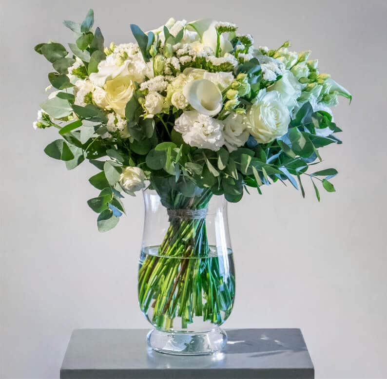Maha White and green bouquet in a vase