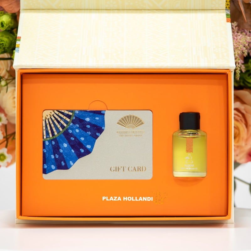 Mandarin spa gift card and oil closeup Mandarin spa gift card and oil closeup