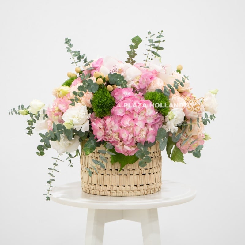 1 Pink and white flower arrangement in a basket