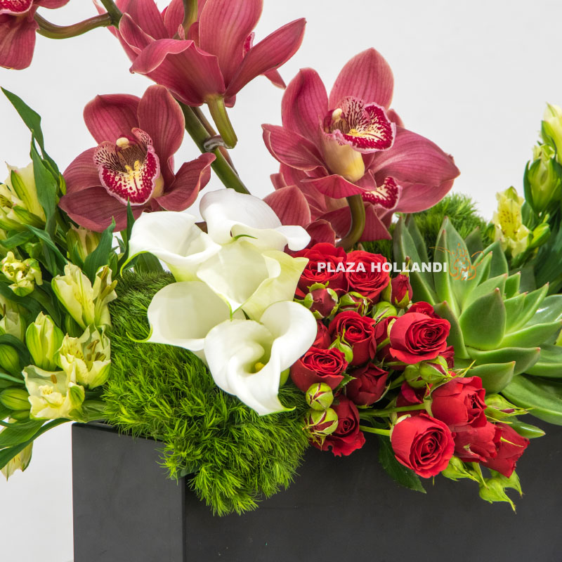 4.1 close up of Black box filled with orchids, eustoma, spray rose and calla lily flowers