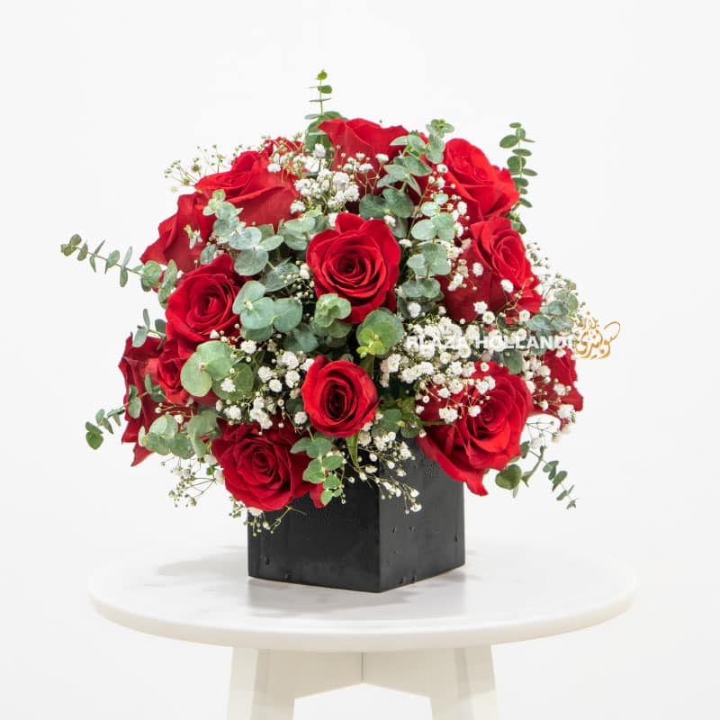 7.3 Red and white flower arrangement in a black box